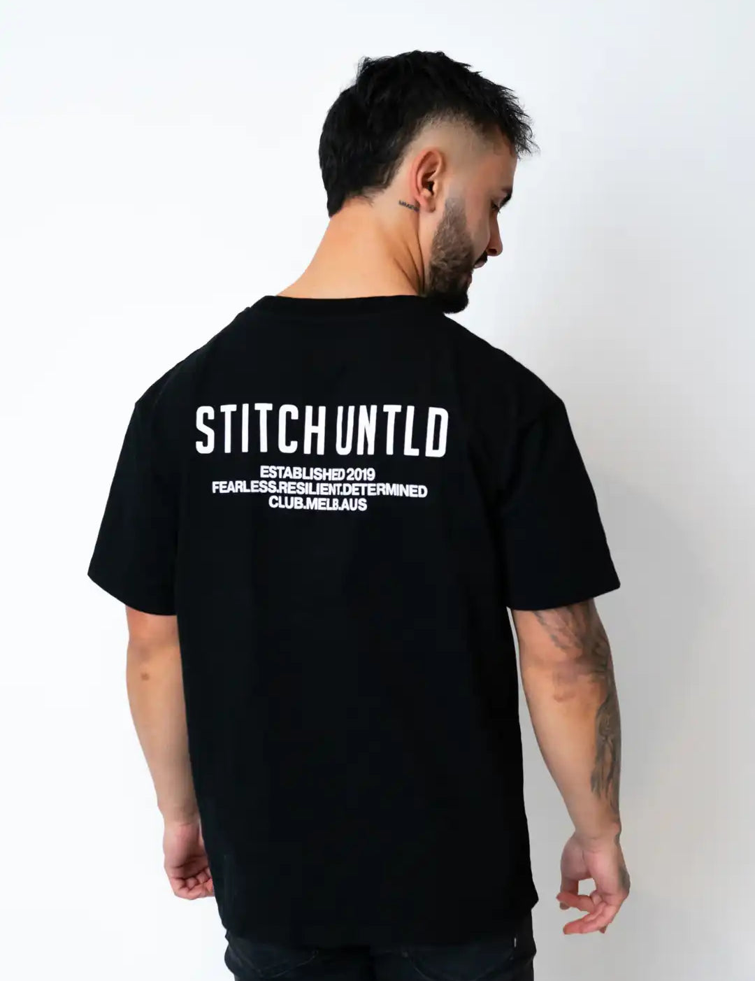 Person wearing stitch untitled club tee