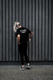 girl wearing stutch untitled club tee standing outside melbourne building