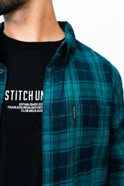 model wearing unisex stitch untitled crossroads flannel shirt