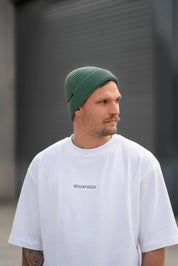 clay smith wearing stitch untitled lux cable beanie