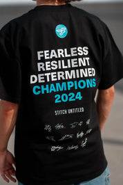 Person wearing a Stitch Untitled and Southside Flyers collaborative Champions Tee