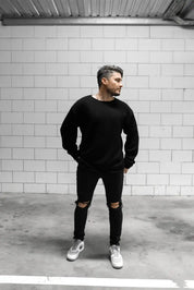 People standing in Melbourne garage wearing stitch untitled black v1 knit