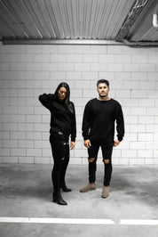 People standing in Melbourne garage wearing stitch untitled black v1 knit