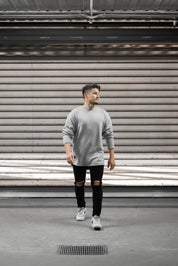 People standing in Melbourne garage wearing stitch untitled grey v1 knit