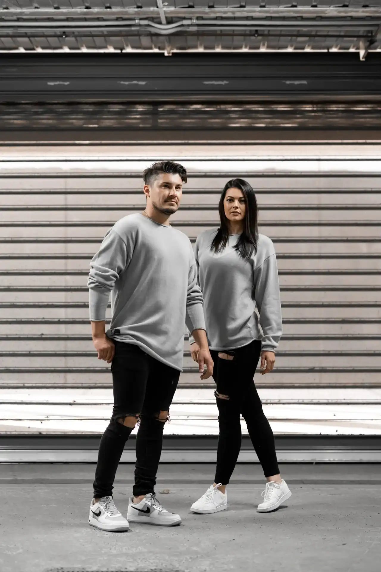 People standing in Melbourne garage wearing stitch untitled grey v1 knit